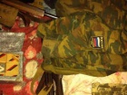 У екс-чиновника Харківщини вилучили зброю, військову форму з шевронами ЗС РФ