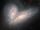 Дві галактики у процесі зіткнення схожі на крила “космічного метелика”