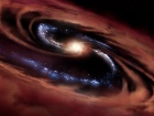 Галактика выживает в пиршестве черной дыры