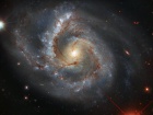 Хаббл показал галактику с "тяжелым" рукавом