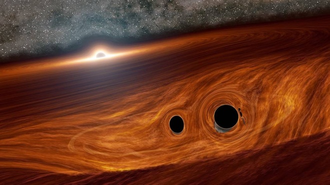 Столкновение черных дыр могло вспыхнуть светом - фото